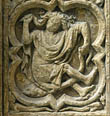 Panel 05:01 - Female (?) hominoid figure holding her hair and tail